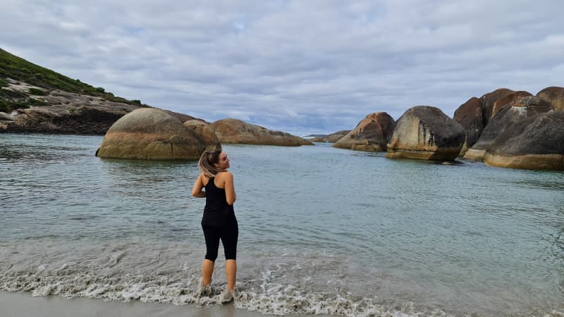 Nadia stands in the water at Elephant Rocks
